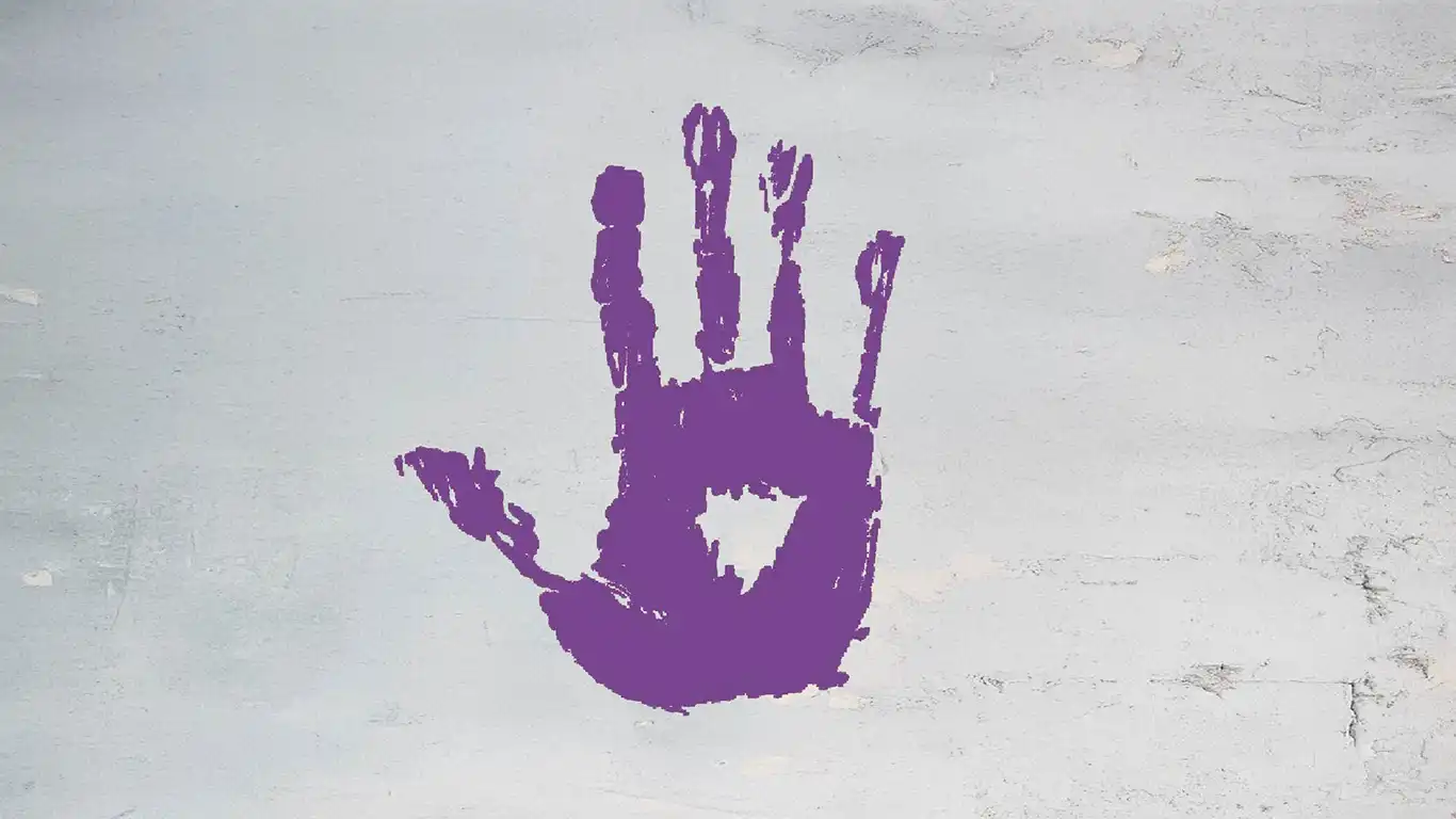 Violences faites aux femmes. Main mauve